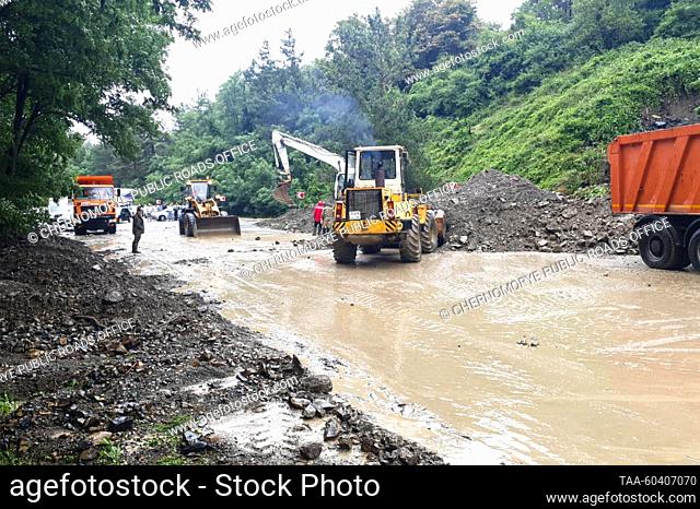 RUSSIA, KRASNODAR REGION - JULY 12, 2023: Clearing a section of the Russian route A147 Dzhubga-Sochi in the Tuapse District after heavy rains