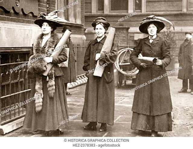 Suffragettes armed with materials to chain themselves to railings, 1909. The Suffragettes found that by chaining themselves to railings they could gain much...