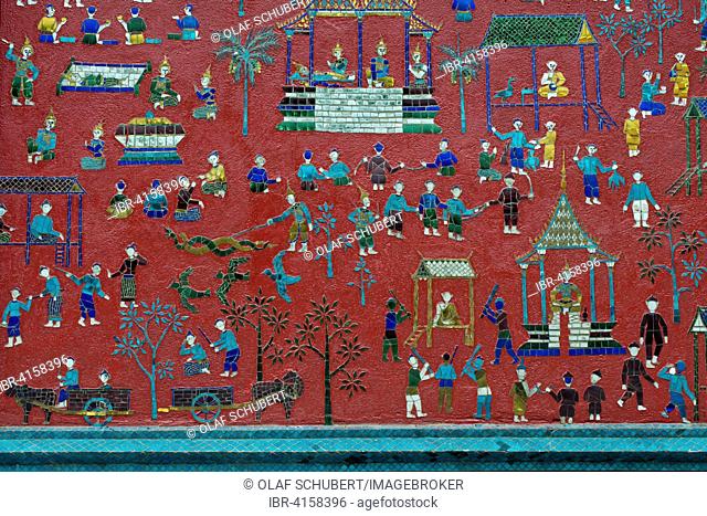 Coloured glass mosaic on a red wall, Wat Xieng Thong, Luang Prabang Province, Laos