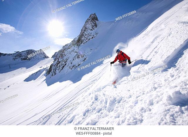 Austria, Tyrol, Stubai valley, man skiing