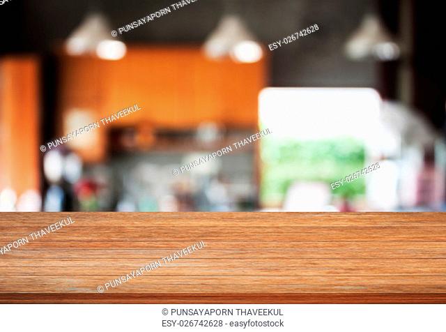 Top wooden with abstract blur coffee shop background, stock photo