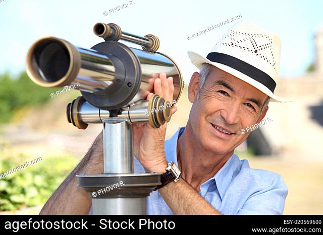 Man looking into a tower viewer