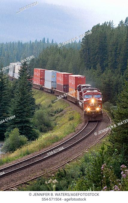 A Canadian Pacific Railway AC4400CW intermodal rounds Morant's Curve as it heads eastbound to Banff, British Columbia, Canada