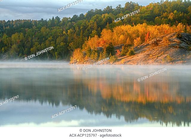 Autumn reflections in Simon Lake at dawn, Greater Sudbury, Ontario, Canada
