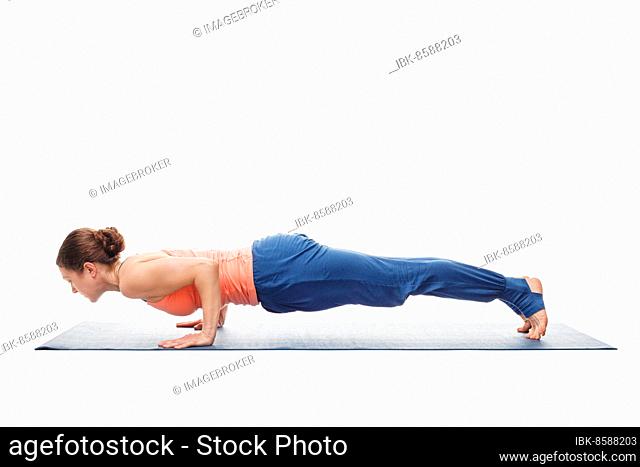 Woman doing Ashtanga Vinyasa Yoga asana Chaturanga Dandasana, four-limbed staff pose posture isolated on white background