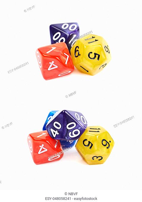 Pile of colorful roleplaying polyhedral dices isolated over the white background, set of two different foreshortenings