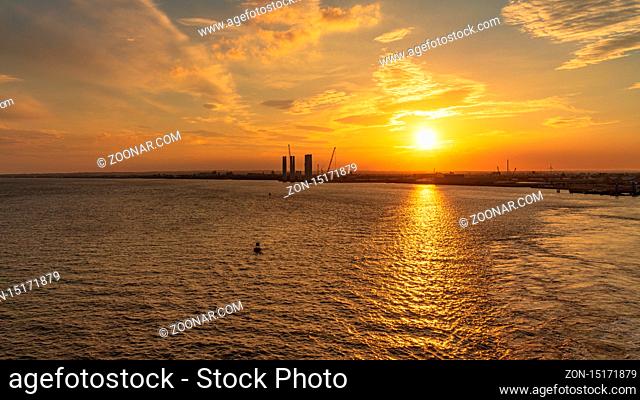 Kingston upon Hull, England, UK - May 22, 2019: The setting sun over the harbour, seen from the River Humber