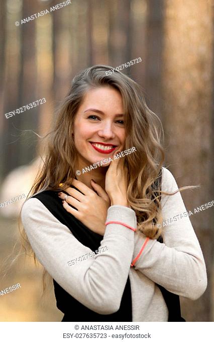 Attractive cheerful smiling happy lucky beautiful girl with beautiful white cute healthy nice smile.Portrait of beautiful girl with cute smile