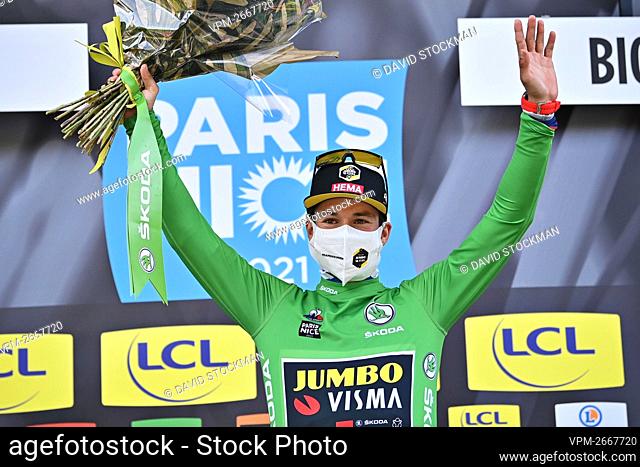 Slovenian Primoz Roglic of Team Jumbo-Visma celebrates on the podium in the green jersey of leader in the sprint ranking after the sixth stage of 79th edition...