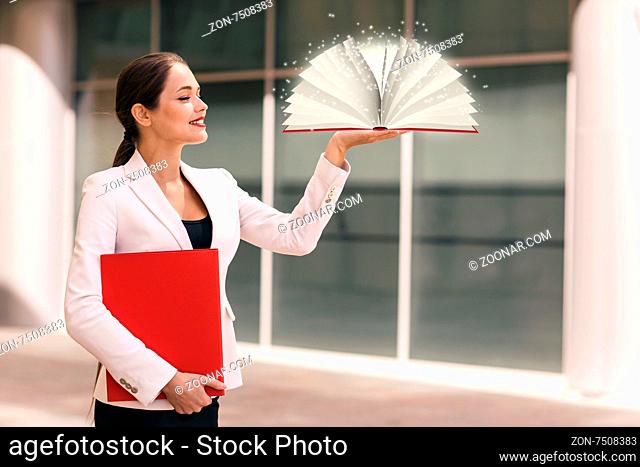 Businesswoman with a book and a folder