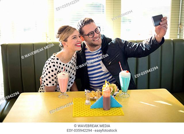 Couple taking selfie with mobile phone