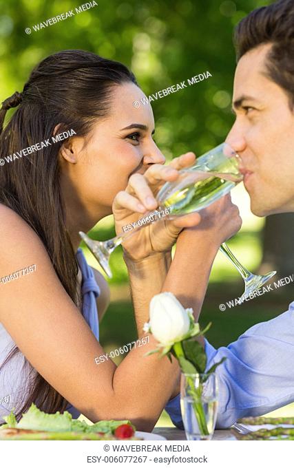 Couple drinking champagne at outdoor caf?®