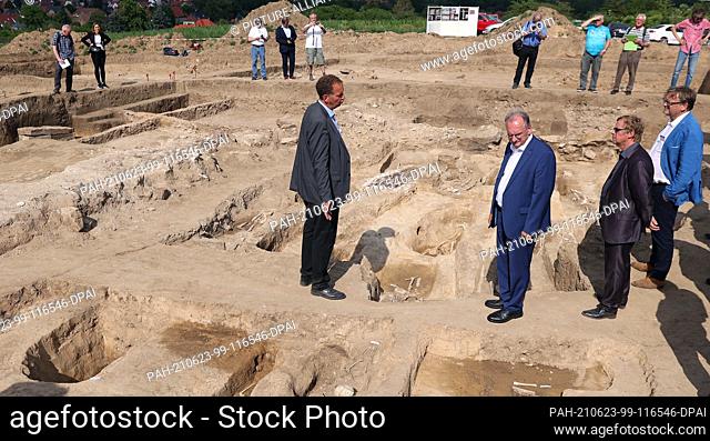 23 June 2021, Saxony-Anhalt, Eisleben: Reiner Haseloff (CDU, M), Saxony-Anhalt's Minister President, has the excavation site above Helfta near Eisleben...