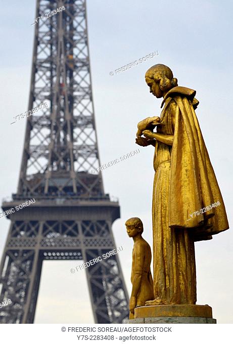 Closed up view of a gilded bronze statues on the central square of the Palais de Chaillot, Paris, France