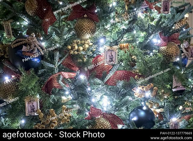 Depictions of US President John F. Kennedy’s official portrait is featured on ornaments hanging from a tree in The Vermeil Room of the White House during the...