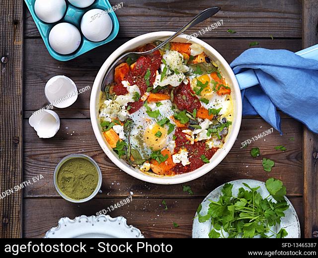 Shashuka with parsley, carrots and tomatoes