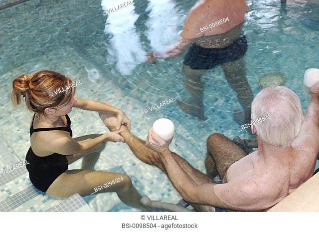 REHABILITATION, ELDERLY PERSON<BR>Photo essay.<BR>Therapy pool at Dinan, in the Britanny region of France.   The sensation of weightlessness is the large...