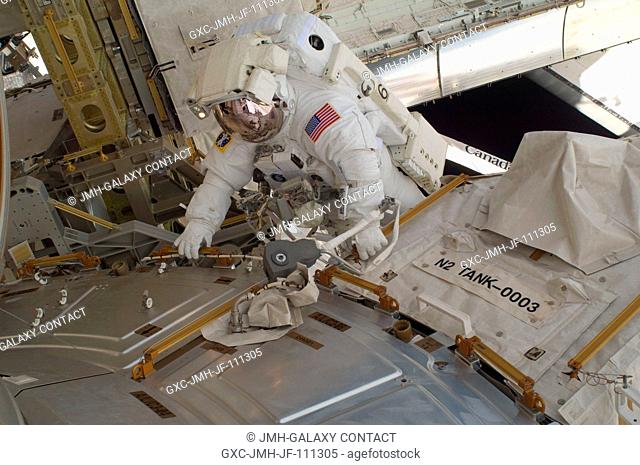 NASA astronaut Nicholas Patrick, STS-130 mission specialist, participates in the mission's first session of extravehicular activity (EVA) as construction and...
