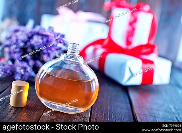 Perfume in bottle on the wooden table