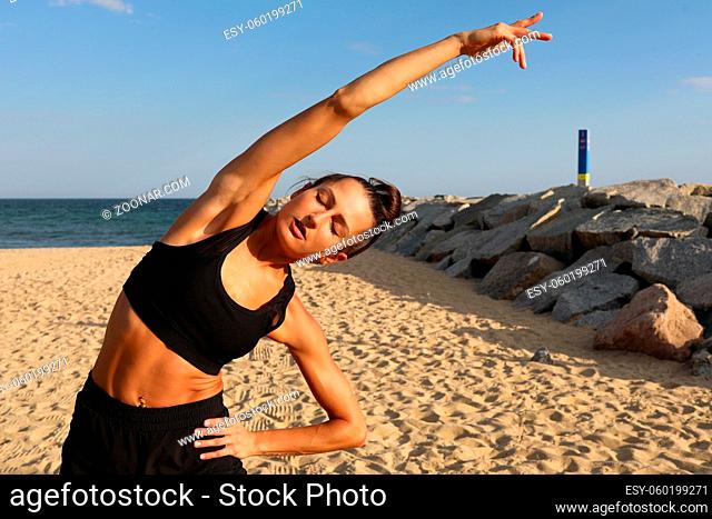 Portrait of sporty woman doing workout. The concept of a healthy lifestyle and sport. High quality photo