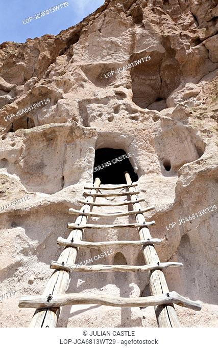 USA, New Mexico, Bandelier National Park. Pueblo ladder enters a cliff dwelling