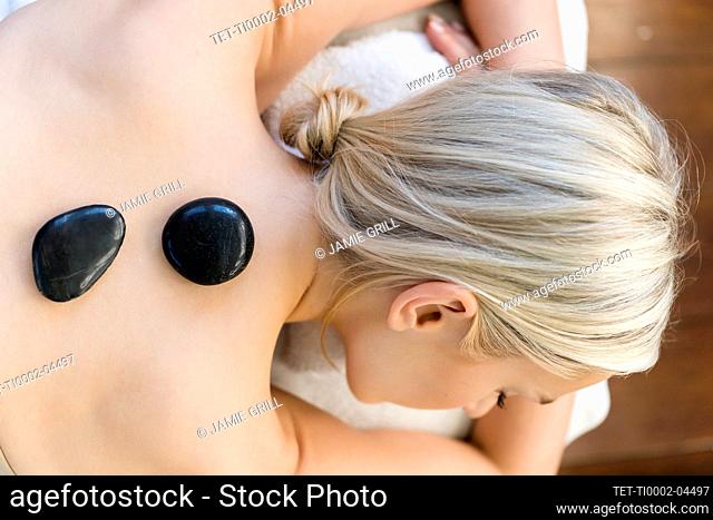 Woman enjoying hot stone massage
