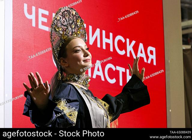 RUSSIA, MOSCOW - NOVEMBER 22, 2023: A model showcases a costume during a show of ethnic costumes inspired by the Ural tales and folk crafts