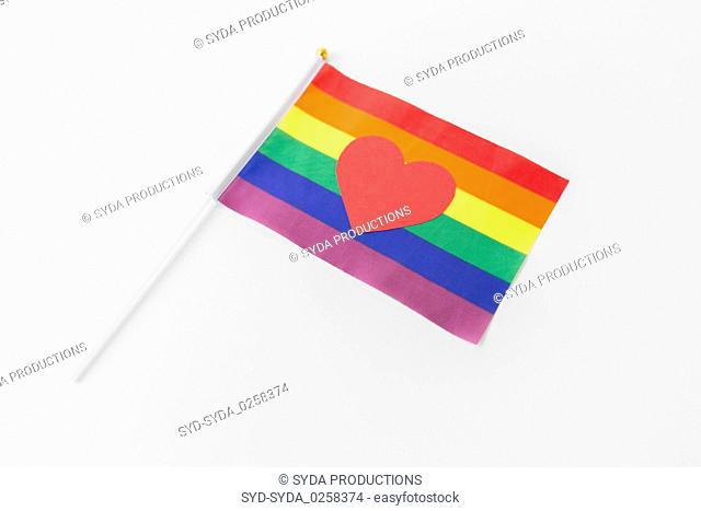 red heart on rainbow flag over white background