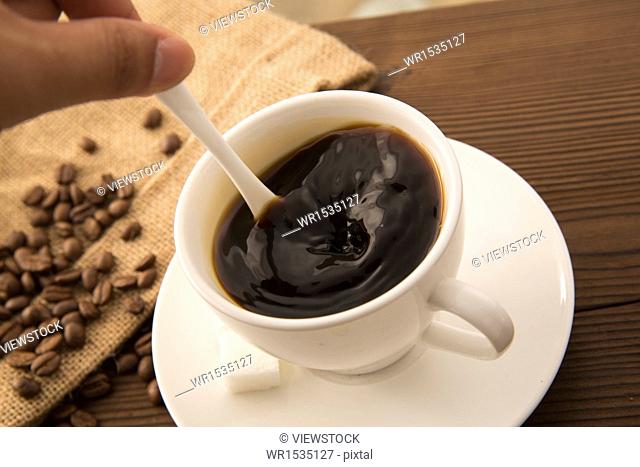 Stirring coffee