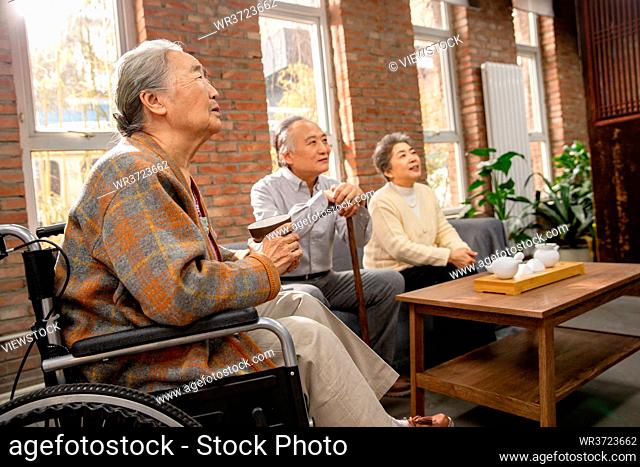 Elderly men gather together to chat
