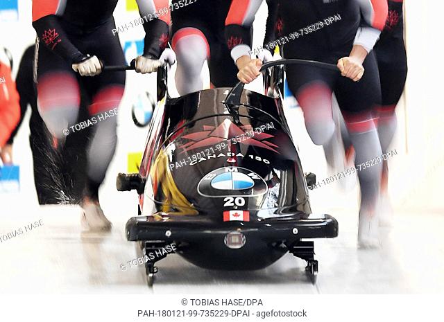 Nick Poloniato, Lascelles Brown, Joey Nemet and Ben Coakwell of Canada in action at the start of the 4-man event at the Bobsleigh World Cup in Schoenau am...