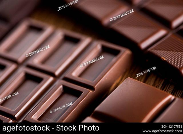 Bars Chocolate , candy sweet, dessert food on wooden background