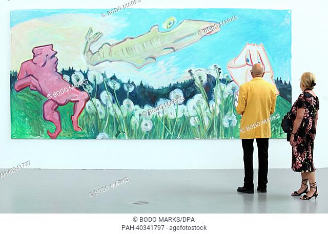 A woman and a man look at the work 'Escape of noses into the Wasen canyon' ('Nasenflucht in die Wasenschlucht') by Austrian painter Maria Lassnig at the...