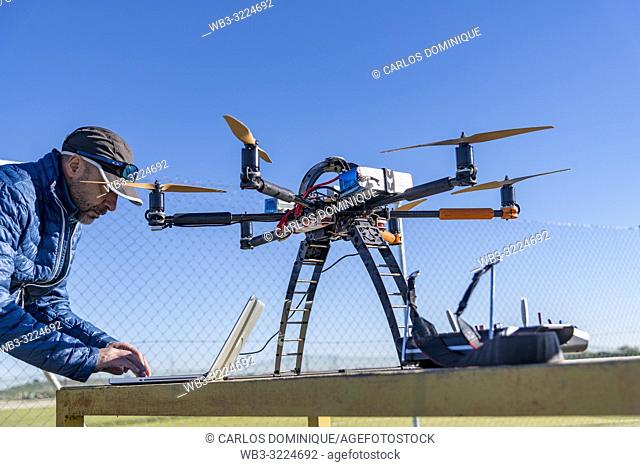 Professional drone before a flight being configured by operator