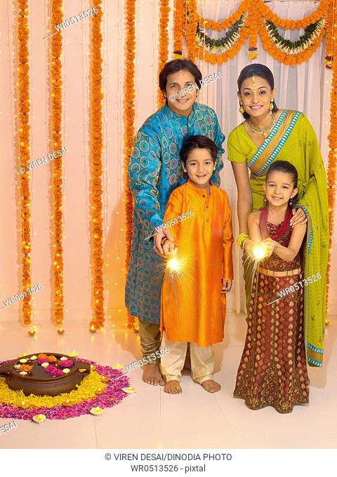 Family celebrates diwali festivals MR779P , MR779Q , MR779R , MR779S