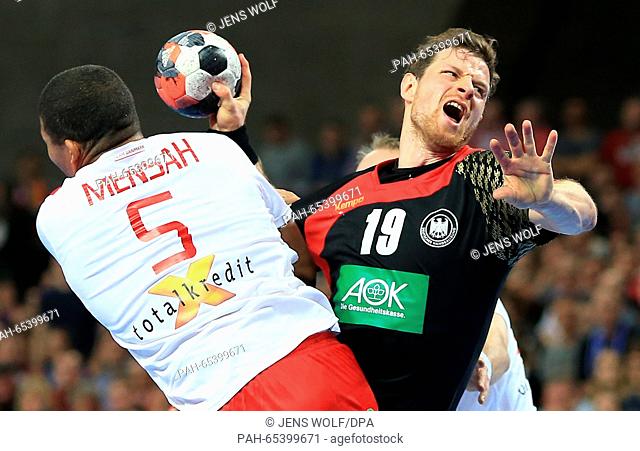 Germany's Martin Strobel in action against Denmark's Mads Mensah Larsen during the 2016 Men's European Championship handball group 2 match between Germany and...