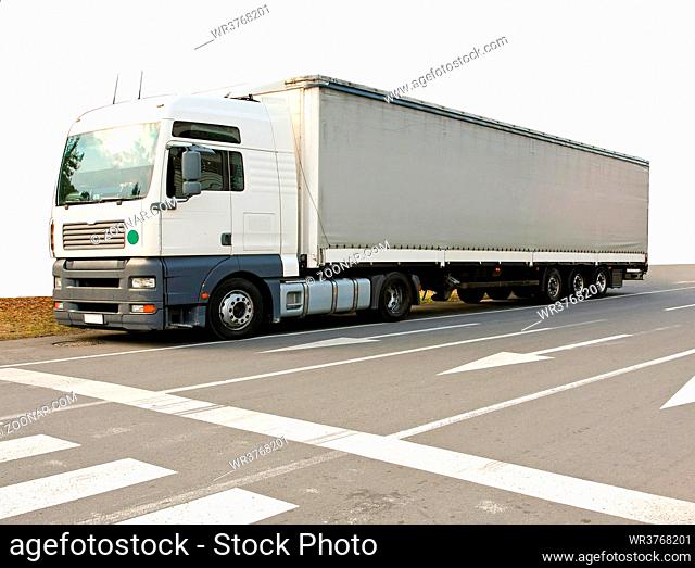 Big and long semi truck at street