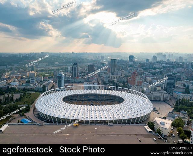 KIEV, UKRAINE - July 19, 2018. Aerial view from drone to a city landscape and National Olimpic Complex in Kiev, Ukraine at sunset on a background cloudy sky in...