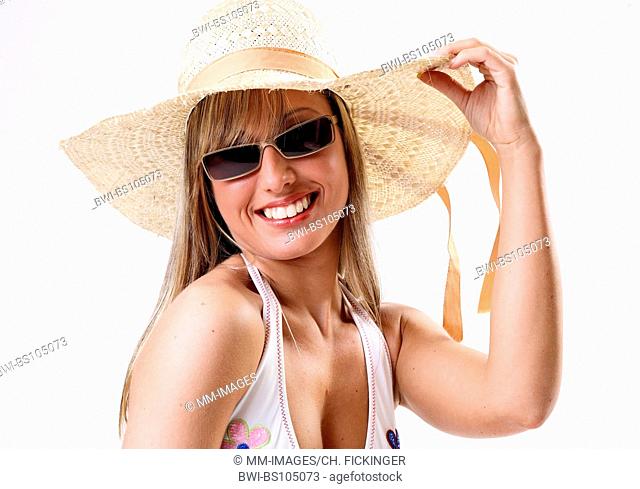 young woman in the summer with straw hat