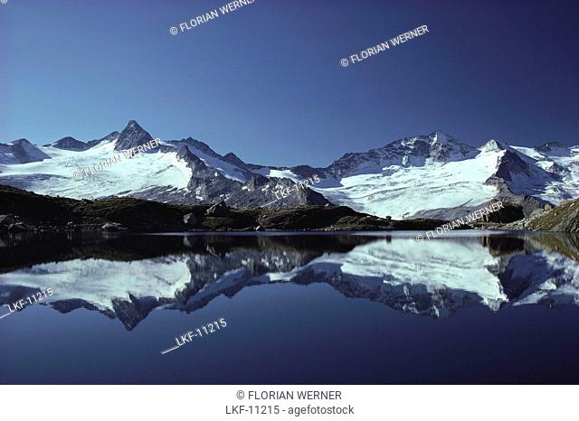 Mountain reflection in a mountain lake, Zillertal Alps, Tirol, Austria