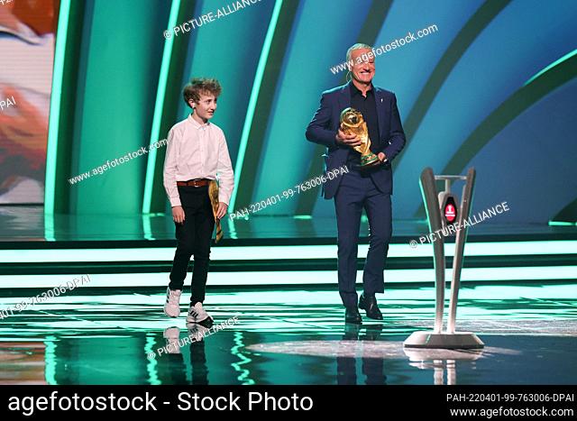 01 April 2022, Qatar, Doha: Soccer: World Cup, draw for the preliminary round in Doha. Dider Deschamps (r), national coach of France