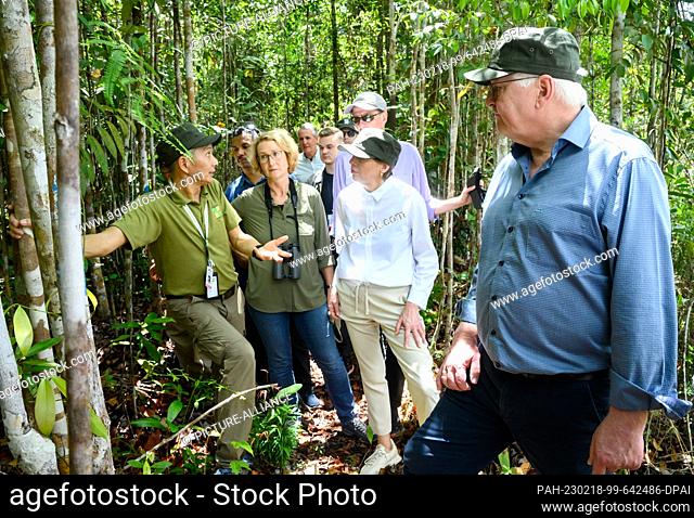 18 February 2023, Malaysia, Kuching: German President Frank-Walter Steinmeier (r-l) and his wife Elke Büdenbender are guided through a jungle in Kuching Wetland...