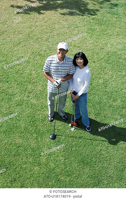 Elevated view of a couple with golf club