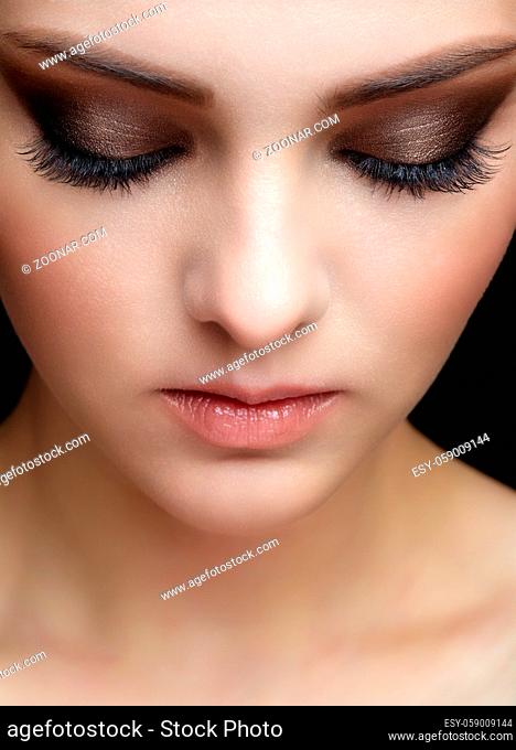 Closeup shot of human female face with eyes closed. Woman with natural face and eyes beauty makeup