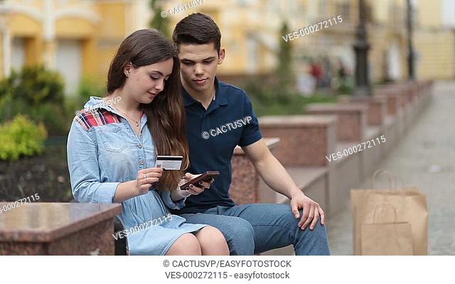 Young couple shopping online with credit card