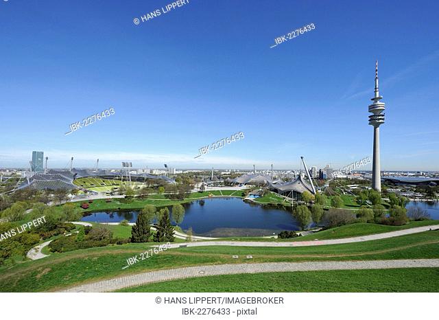 View from Olympiaberg hill to Olympiapark with the Olympic Stadium, swimming pool and TV tower, Munich, Bavaria, Germany, Europe, PublicGround