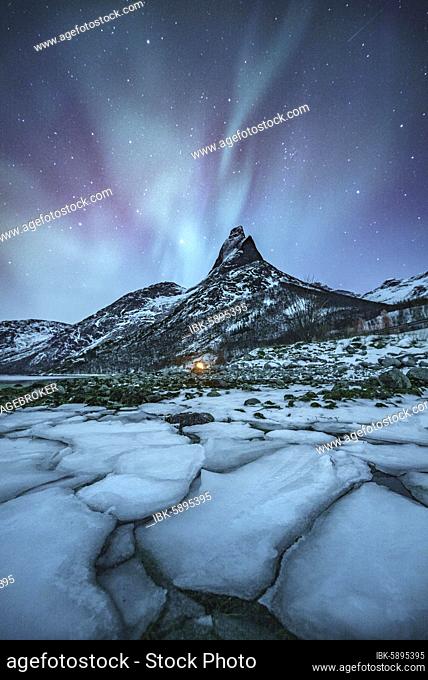Mountain peak (Aurora borealis) Stetind, arctic winter landscape, night view, starry sky, northern lights Northern Lights, in front ice floes, Stetinden