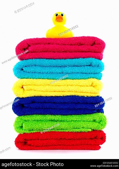 Colored bathroom towels isolated against a white background