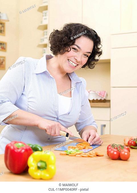 woman cutting vegetables