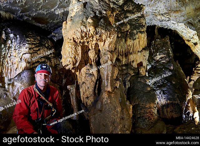 Speleologist in the Grotto de la Malatiere in France